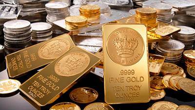 Золото и серебро умеренно дешевеют 4 февраля на сильном долларе