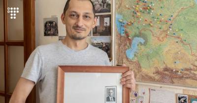 В России фото омоновца на фоне портрета Путина продали за 2 млн рублей. Его называют символом нынешней РФ