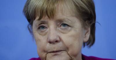 Партия Меркель терпит поражение на региональных выборах в Германии