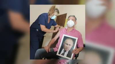 60 минут. Мэр аргентинского города привился от COVID-19 с портретом Путина в руках