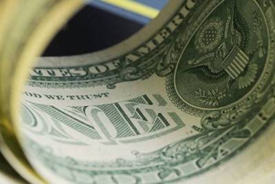 Доллар дешевеет к мировым валютам на низкой доходности гособлигаций США