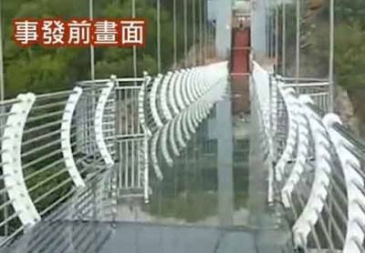 В Китае турист завис над пропастью в 100 м на разрушенном стихией стеклянном мосту (ФОТО)