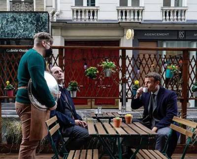 Президент и премьер Франции чашкой кофе отметили открытие летних террас во французских ресторанах после ослабления карантина