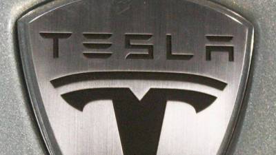 Владельцы Tesla получат по 16 тысяч долларов