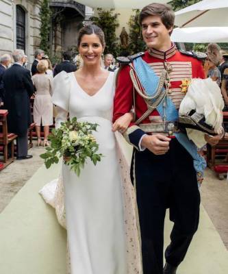 Платье невесты, расшитое золотом, на королевской свадьбе самого завидного жениха Испании