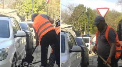 В Одессе укладывают асфальт под припаркованные авто: кадры отчаянной работы