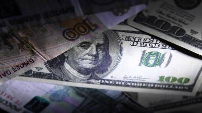 Эксперт связал повышение ЦБ курса доллара с его подорожанием на рынке
