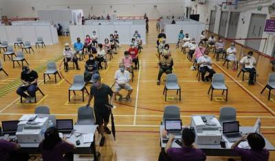 Сперва тесты, потом слежка: в Сингапуре придумали, как жить без карантинов