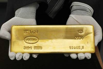 Золото перешло к снижению на дорогом долларе