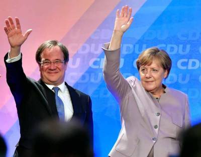 Партия Меркель перед выборами отрывается от конкурентов