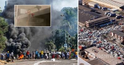 Беспорядки в ЮАР: женщина выбросила ребенка из окна, его спасли – видео - obozrevatel.com - Юар - Дурбан