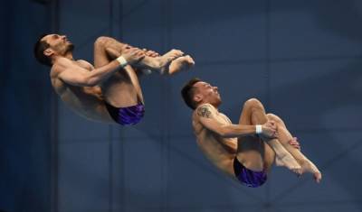 Бондарь и Минибаев завоевали олимпийскую бронзу в синхронных прыжках с вышки - newizv.ru - Токио - Англия