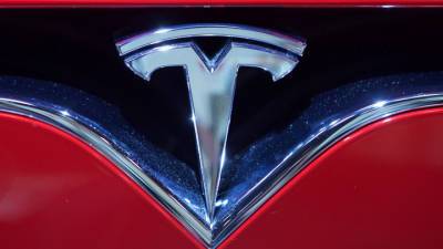 Tesla сообщила о потерях на биткоине и рекордной прибыли