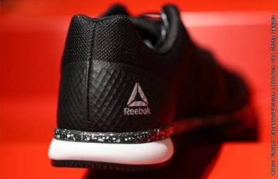Adidas продает Reebok за 2,1 млрд евро - interfax.ru - Москва - Россия - США - Германия