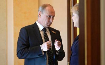 Читатели британской прессы предполагают, что Путин обсудит с Меркель раздел Украины