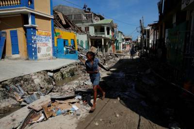 Число жертв землетрясения на Гаити возросло до 1419 человек
