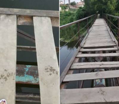 На Черкасчине люди ежедневно рискуют провалиться в реку через пропасть в аварийном мосту