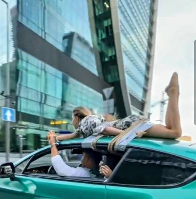 Блогер привязал девушку к крыше Bentley и прокатился на фоне «Москва-Сити»