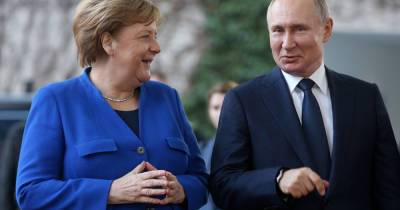 Путин пожаловался Меркель на украинский законопроект о переходном периоде