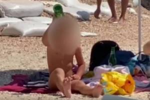 В Кирилловке ребенок пил пиво на пляже. ВИДЕО