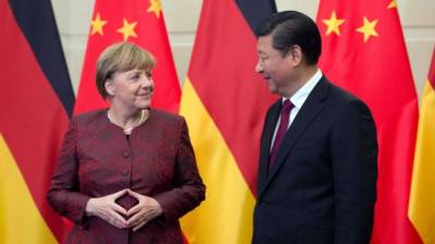 Си Цзиньпин предложил Меркель изменить политику ЕС по отношению к Китаю