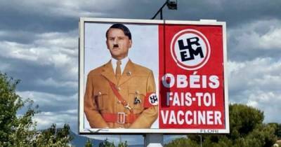 "Подчиняйся и сделай прививку": автор плаката с Макроном в образе Гитлера получил штраф (фото)