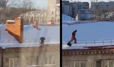 В Тюмени двое рабочих чистили снег на крыше дома без страховки
