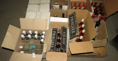 ФОТО. Дело о незаконной реализации алкоголя: полиция изъяла почти 12 000 бутылок водки, виски и вина