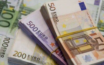 Украина должна получать денежную помощь ЕС автоматически - еврокомиссар