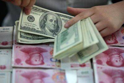 Китайские банки продают доллары для поддержки юаня