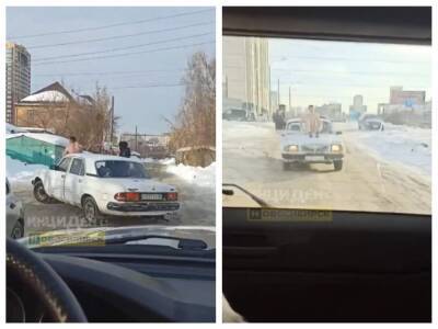 В Новосибирске голый парень прокатился на капоте «Волги»