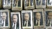 Пабло Эскобар - В Ливии на побережье нашли сотни упаковок гашиша с фото Путина - vlasti.net - Колумбия - Ливия - Аргентина