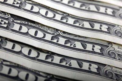 Средний курс доллара США со сроком расчетов "завтра" по итогам торгов составил 60,9466 руб.