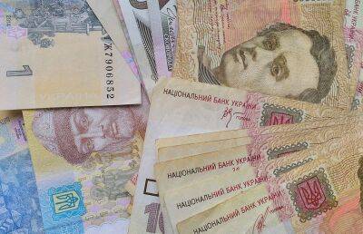 Нацбанк Украины понизил курс гривны за доллар
