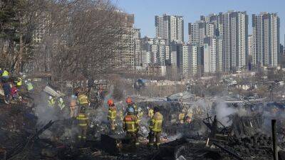Сеул: пожар в трущобном посёлке на фоне небоскрёбов
