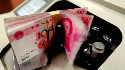 Названа причина роста доли юаня в торговых расчетах через SWIFT