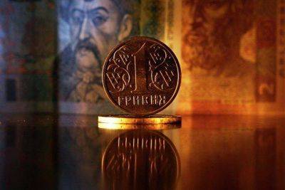 ЦБ Украины понизил курс гривны почти до 38 к доллару