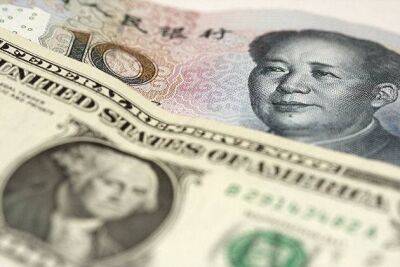 Курс юаня упал до минимальных почти за месяц 6,9 за доллар в ожидании статистики по США