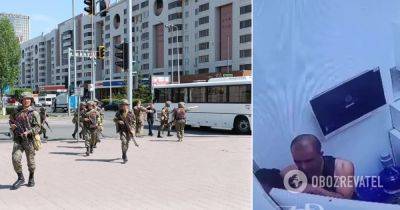В Казахстане вооруженный мужчина взял в заложники людей в отделении банка - силовики начали спецоперацию - видео