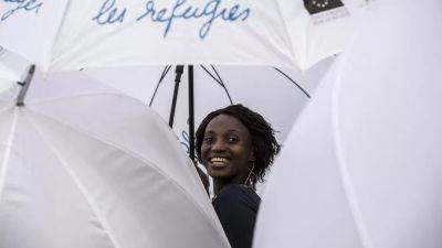 Приём беженцев: "марш зонтиков" в Лионе