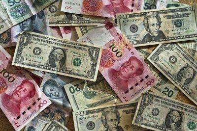 Рубль перешел к росту против доллара и юаня