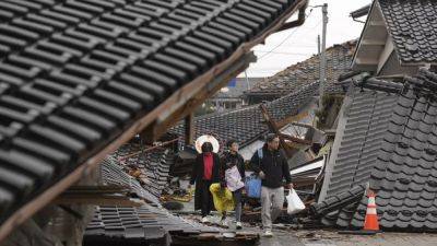 Землетрясение в Японии: афтершоки мешают работе спасателей