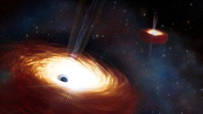 Астрономы взвесили самую массивную пару черных дыр из когда-либо найденных